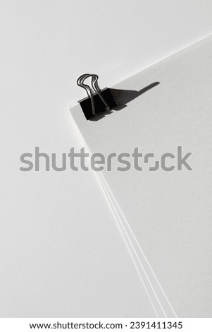Blank Sheets of Paper Binded by Foldback Clip. Business Meeting Mockup. Education Concept.
