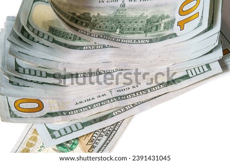 A stack of US 100 bills on a white background.  Synonymous with wealth and abundance.