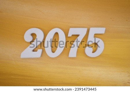 The golden yellow painted wood panel for the background, number 2075, is made from white painted wood.