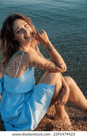 beautiful woman sitting by the seashore leisure beach walk