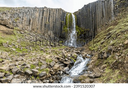 Jokla River cuts through the Studlagil canyon and passes by the hexagonal basalt columns caused by lava flows in Northeast Iceland, Jokuldalur Valley, Europe Royalty-Free Stock Photo #2391520307