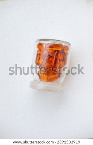 Close-up photo of some yellow capsules - vitamin concept photo