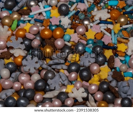 Edible colored sugar pearls used as decoration in the food industry.