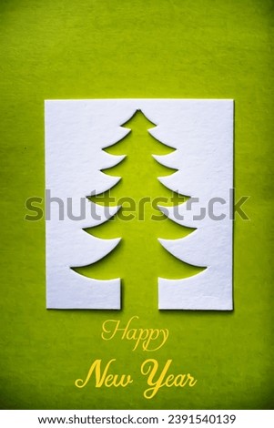 Christmas tree paper cutting design papercraft card. White, red and green color
