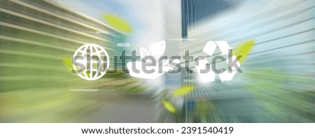 Environmental concept. 3 recycle icons on motion blur of business city on background.