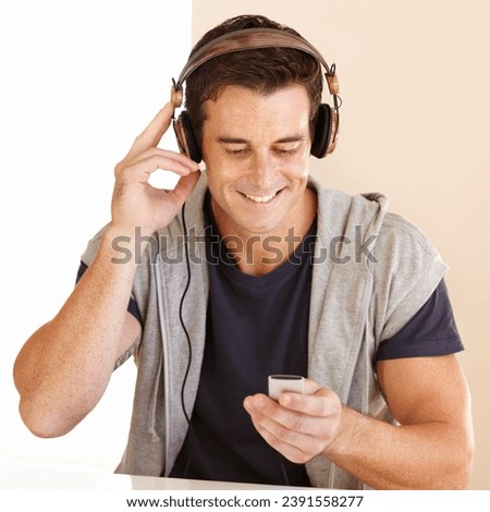 Man, music player and headphones in home for listening to audio, digital radio and podcast. Happy guy streaming portable playlist of songs, hearing sound and multimedia subscription for entertainment