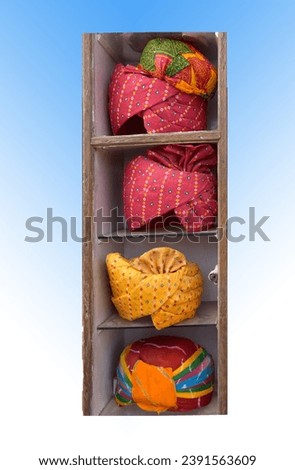 Multicolours Head-cap (Rajasthani Pagri) display in the box. Royalty-Free Stock Photo #2391563609