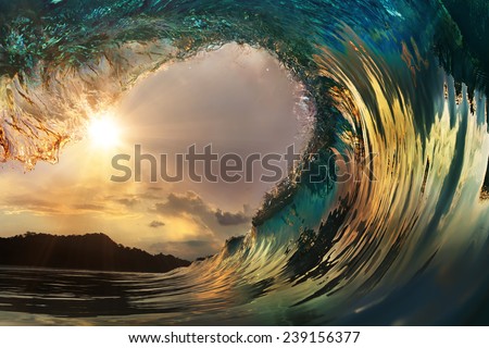 Beautiful ocean surfing wave at sunset beach