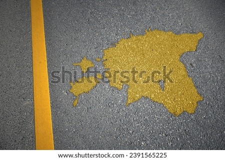yellow map of estonia country on asphalt road near yellow line. concept