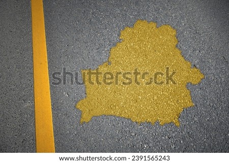 yellow map of belarus country on asphalt road near yellow line. concept