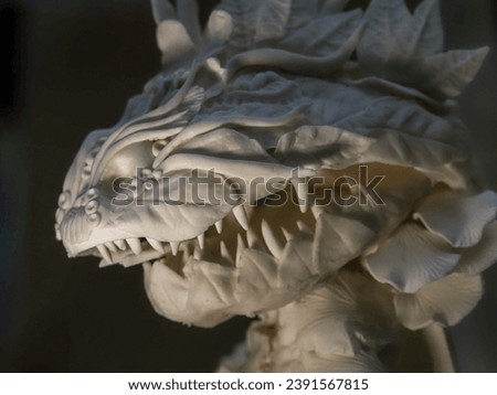confectionery figure head of a white Basilisk close-up