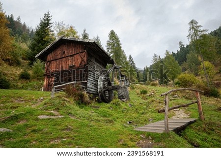 Old wooden water mill on a mountain near the place of Terenten in Puster Valley in South Tyrol, Italy Royalty-Free Stock Photo #2391568191