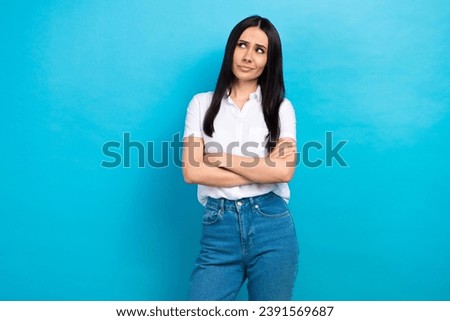 Photo of confident suspicious lady wear white shirt arms crossed looking empty space isolated blue color background Royalty-Free Stock Photo #2391569687