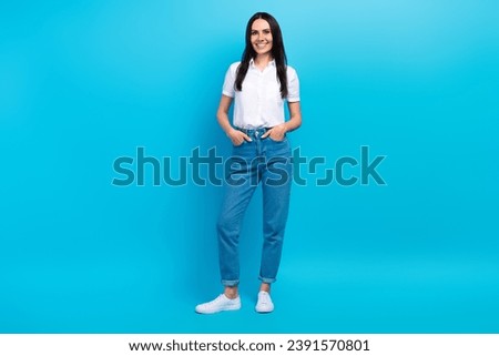 Full length photo of sweet shiny lady wear white shirt smiling walking isolated blue color background
