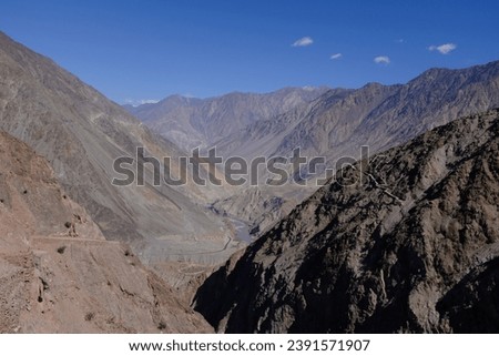 View of the dried, treeless high mountain ranges on the way towards Fairy Meadow, Karakoram Highway, Pakistan.