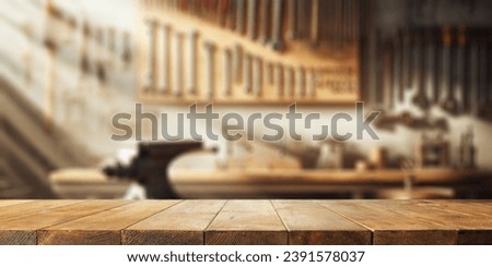 Worn old wooden table and workshop interior. Retro vintage photo of background and mockup. Sun light and dark shadows.  Royalty-Free Stock Photo #2391578037