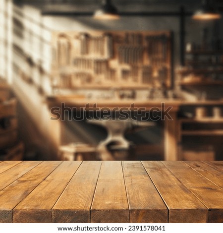 Worn old wooden table and workshop interior. Retro vintage photo of background and mockup. Sun light and dark shadows.  Royalty-Free Stock Photo #2391578041