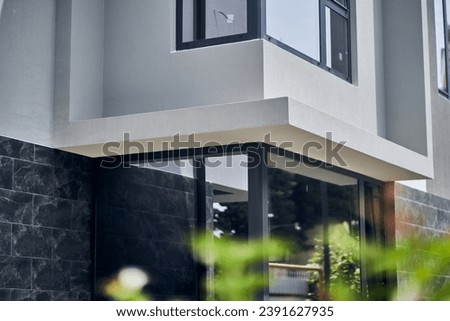 Modern hotel, exterior of the building. Tourist apartment, on the corner of the building. Street architecture, landmark of a business resort, tourist service, with space to copy. High quality photo