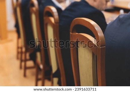 Group of men in business suits talking and discussing at conference, politicians and entrepreneurs debate, networking and negotiate, businessmen have dialog conversation on a forum, panel discussion