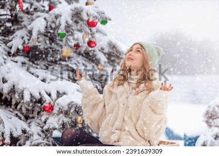 Positive and lifestyle concept. Photo of excited young girl happy positive smile rejoice snowy weather winter walk on Christmas holiday