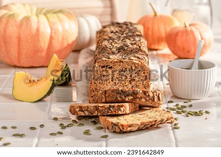 Fresh pumpkin bread with sesame seeds and grains. Freshly baked bread with pumpkin seeds.