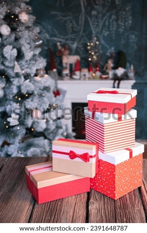 gift boxes in front of Christmas tree
