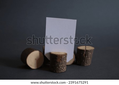White empty cards with copy space in natural wooden stump.