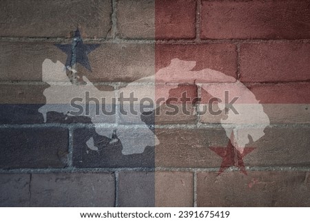 painted map and flag of panama on a old brick wall