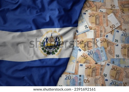 big colorful waving national flag of el salvador on a euro money background. finance concept