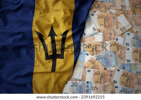 big colorful waving national flag of barbados on a euro money background. finance concept