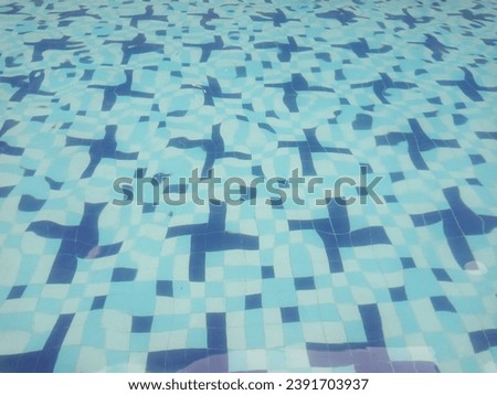 the floor of the swimming pool with a blue motif