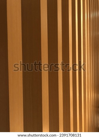 Beautiful abstract pattern of light color wood vertical stripe in angle with edge, wall decorated with wooden planks, Futuristic geomatric wall design, wood pattern Royalty-Free Stock Photo #2391708131