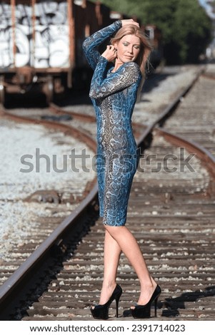 Photo of a beautiful Russian lady outdoors at railway yard
