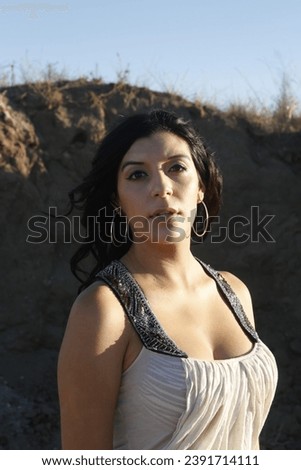Photo of a beautiful Hispanic girl in a construction site