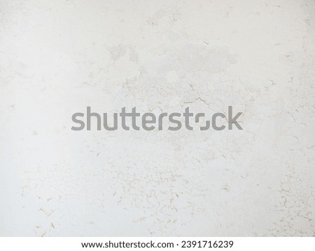 Ceiling of an old apartment. Crumbling plaster. The housing requires renovation. Background made of peel-off coating. Poverty