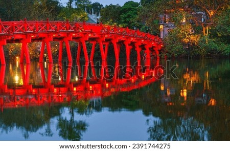 Iconic red bridge named The Huc on Hoan Kiem lake, center of Hanoi, Vietnam Royalty-Free Stock Photo #2391744275