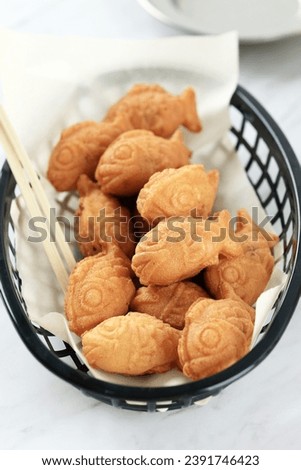 Mini Taiyaki Bungeoppang Korean Japanese Street Food with Adzuki Paste Filling Royalty-Free Stock Photo #2391746423