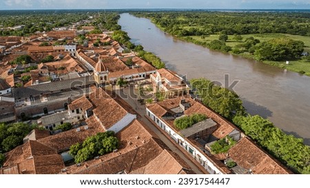 Aerial view of the historic town Santa Cruz de Mompox and river in sunlight, Colombia, World Heritag