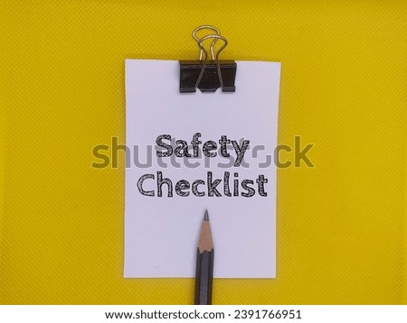 Picture of a pencil and a notepad with pencils on a yellow background.