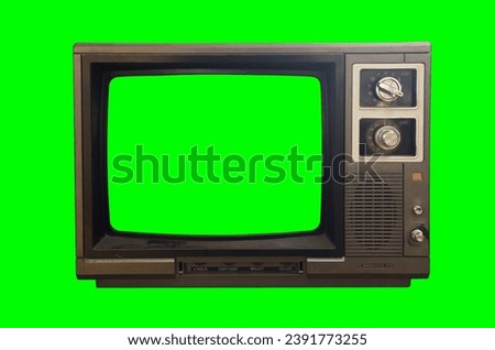 Old TV with a green screen on a green background. Retro technology concept.