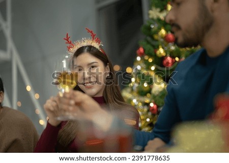 close up girl hold glasses of champagne with lighting. Dinner party with drinking of champagne. hands holding clear glass with alcohol in yellow shine reflect.