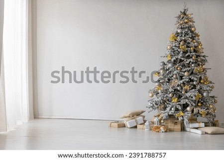 christmas tree with gifts and toys decorated with christmas garland