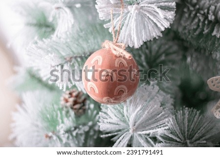 Christmas bauble on the fir tree branch