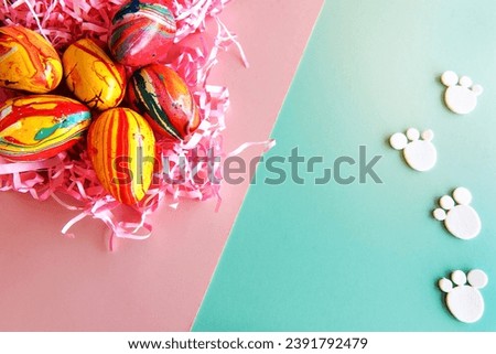 Easter decoration on pink and green background.