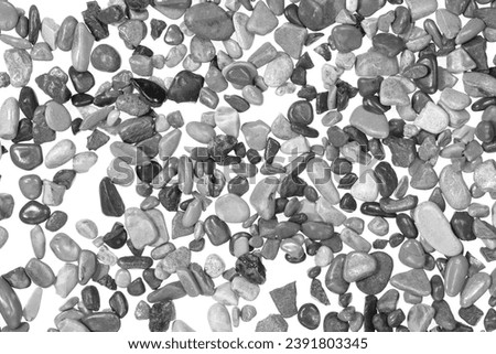 Black pebbles isolated on white background. dark natural aquarium soil. beach pebbles texture close up