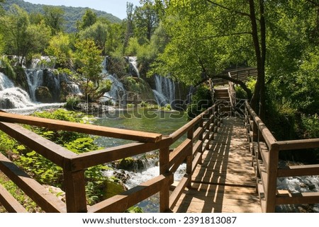 Milancev Buk waterfall at Martin Brod in Una-Sana Canton, Federation of Bosnia and Herzegovina. Located within the Una National Park, it is also known as Veliki Buk or Martinbrodski Royalty-Free Stock Photo #2391813087