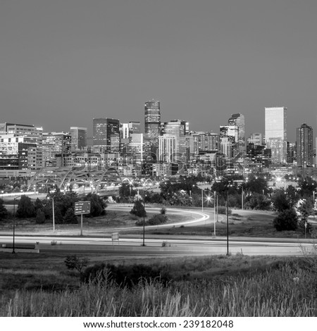Panorama of Denver skyline long exposure at twilight in black and white.