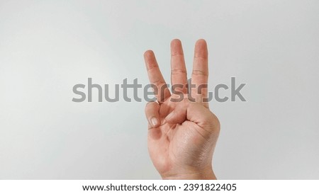 Hand gesture close up, number three sign, varuna mudra, . Isolated on white background