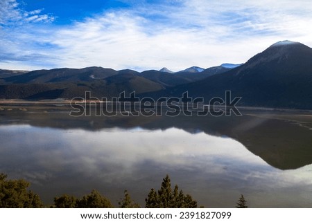 
Tranquil lake view with perfect reflections, creating a serene and harmonious scene. 