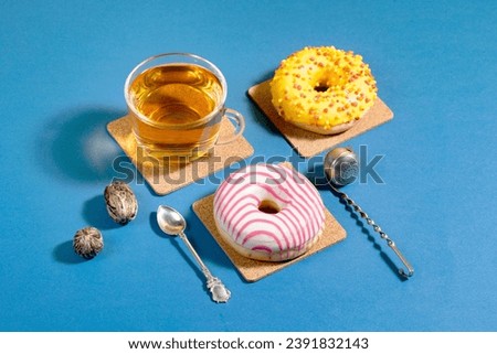 Tea in a cup on a bright colored background, in a composition with accessories